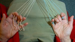 fingerloop braiding with knotted-up ends to the loops - caterpillars