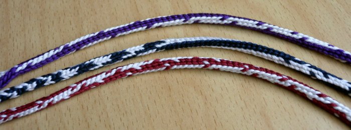 Doug's Braids, bicolor loops. 7-loop round spanish-type fingerloop braids. loopbraider.com