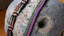 Two loop braids showing variations of the same color-linking pattern