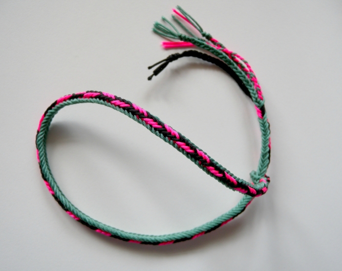 Unorthodox 7-loop braid, showing flat lower surface and rounded upper surface. (made with Chinese knotting cord)